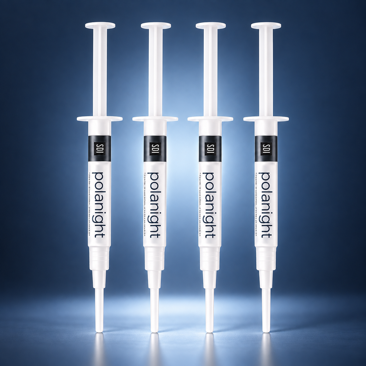 4 SDI PolaNight teeth whitening gel syringes with a soft blue studio glow