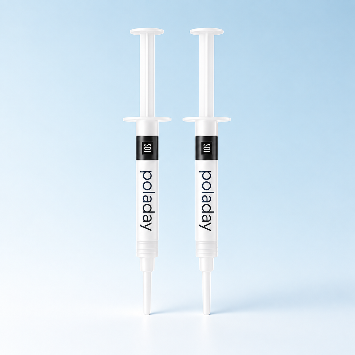 SDI PolaDay teeth whitening gel, 2 syringes on a pale blue background