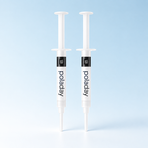 SDI PolaDay teeth whitening gel, 2 syringes on a pale blue background